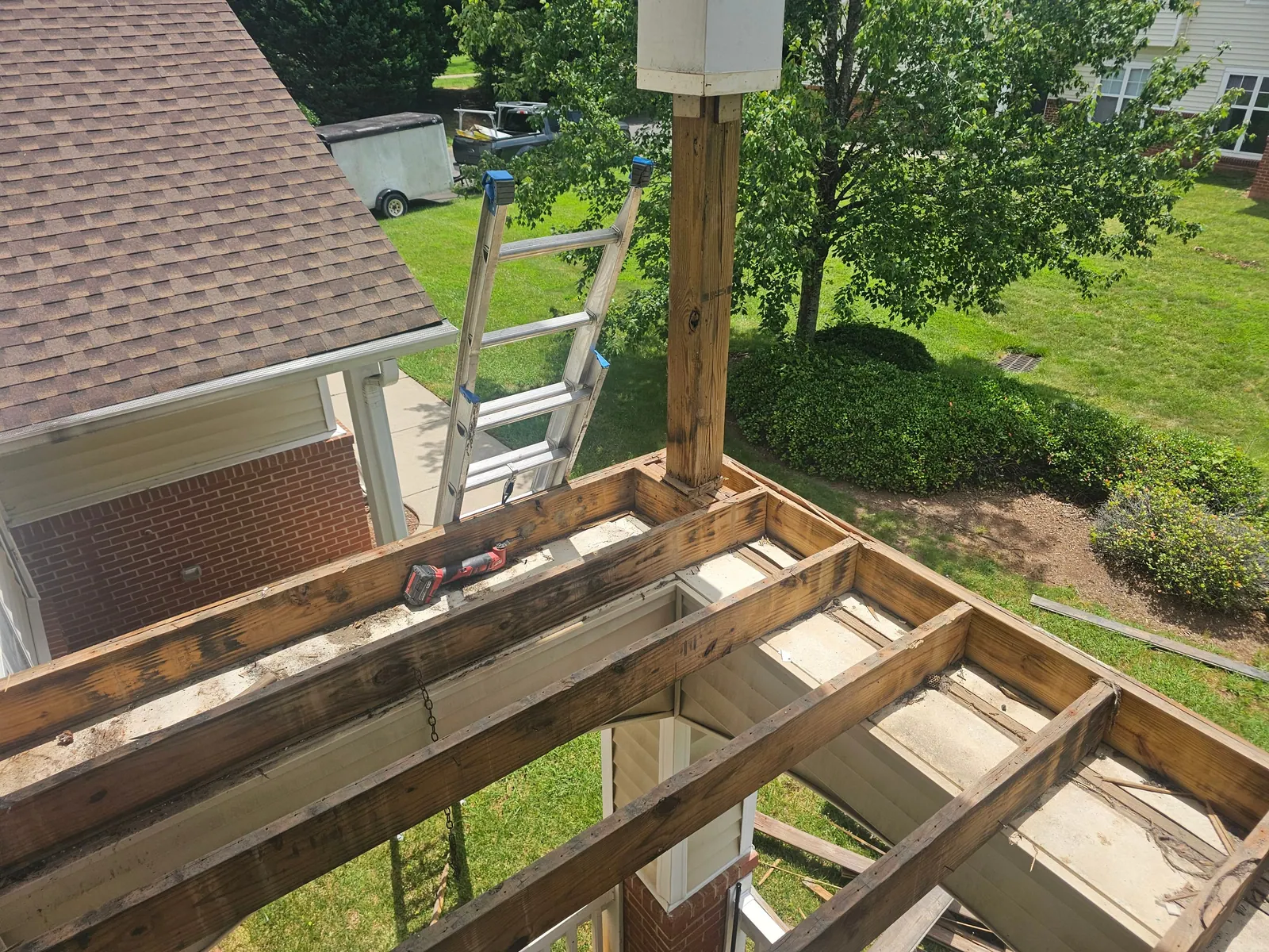 Second-story balcony stripped to its framing during a rebuild